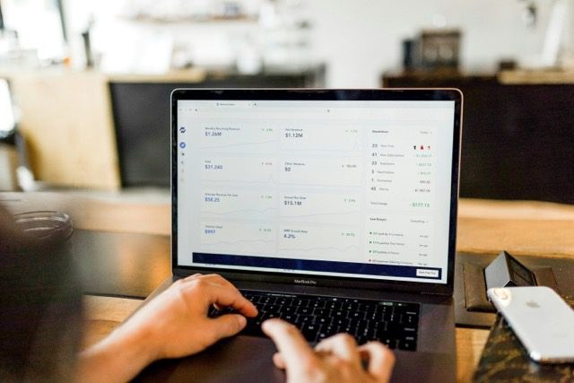 A stock photo of a laptop showing a generic SaaS dashboard. Not a real Google Analytics 4 screen.